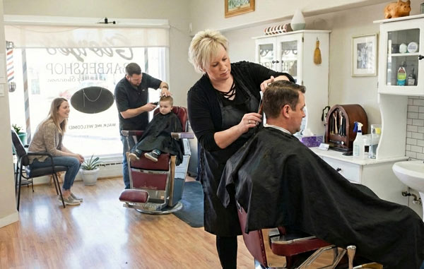 George's Barber Shop customers getting hair cuts in Prince George